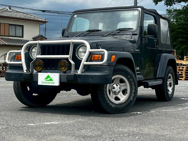 スポーツ　ワンオーナー・５速ＭＴ・純正オーディオ・グリルガード・背面タイヤ・ソフトトップ・ディーラー車・４ＷＤ・エアコン