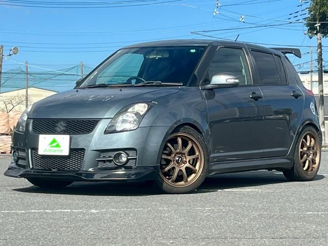 スイフト(スズキ) スポーツ 全国1年保証・5速MT・GReddyマフラー・車高調・17インチAW・GReddyエアロ・リアスポイラー・MOMOステ・カロッツェリアナビ・地デジTV・バックカメラ・ETC・HIDライト・スマートキー 中古車画像