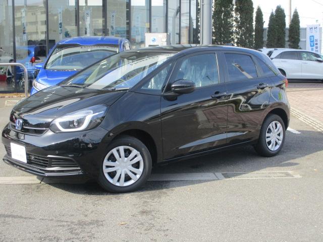 フィット（ホンダ）ｅ：ＨＥＶホーム　登録済未使用車・ホンダセンシング・チップアップシート　リヤカメラ　ＶＳＡ　サイドカーテンエアバック　スマートキ　踏み間違い防止　盗難防止装置　クルコン　パワーウィンドウ　ＬＥＤヘッドライト　キーフリー 中古車画像