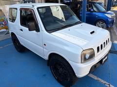 ジムニー XG 4WD CDオーディオ ETC ABS PS PW 衝突安全ボディ キーレスエントリー 運転席エアバッグ 助手席エアバッグ フルフラット シートカバー 社外ホワイトレタータイヤ&ホイール 中古車画像