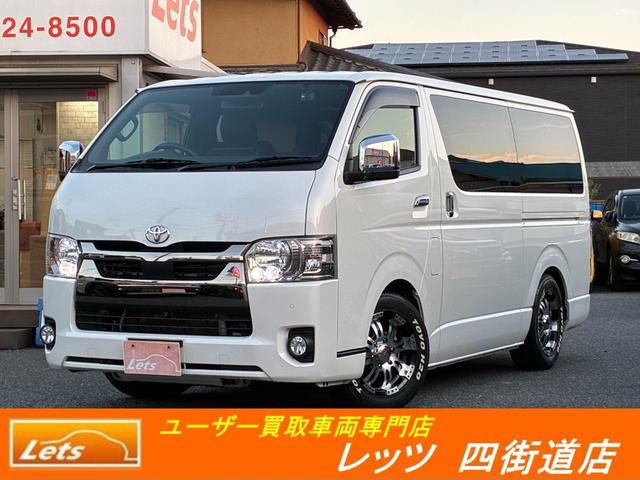 ハイエースバン(トヨタ) スーパーＧＬ　ダークプライムＩＩ　４ナンバー８人乗り・構造変更済車検対応・ＲＥＶＯシート・フロアフローリング・ロングスライドレール・フルフラットベッド・アラウンドビュー・１０インチディスプレイ・ＥＴＣ・前後ドラレコ・ワンオーナー 中古車画像