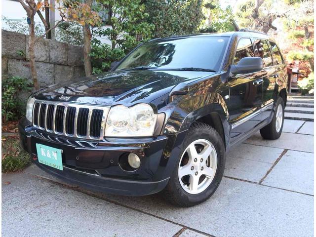 ジープ・グランドチェロキー(ジープ) リミテッド４．７　４ＷＤ　ガレージ保管　ディーラー記録簿　ナビ付き　（ブラック） 中古車画像