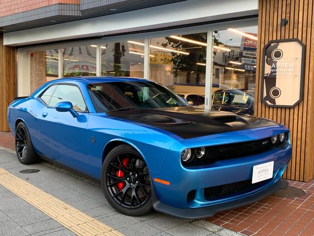 ダッジ ダッジ チャレンジャーｓｒｔ ヘルキャット 新車並行 ６速ｍｔ ｖ８スーパーチャージドｈｅｍｉエンジン７０７ｐｓ 本革シートｈ ベンチレーション アルパインナビ ｔｖ ｂカメラ ステアリングｈ ブレンボ製６ｐｏｔブレーキシステム ｓｒｔ２０ａｗの中古車