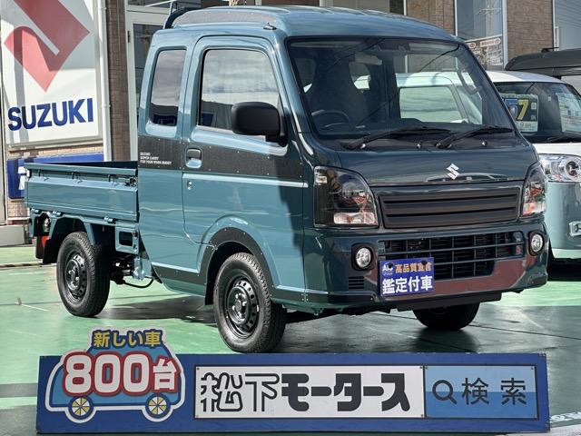 スーパーキャリイ Ｘリミテッド　４ＷＤ　４ＡＴ　特別仕様車　専用フロントガーニッシュ　専用サイドデカール　ＬＥＤヘッドランプ＆フォグランプベゼル（ブラック塗装）専用スチールホイール（ブラック塗装）　キーレス　届出済未使用車（1枚目）