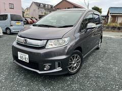 フリードスパイクハイブリッド ハイブリッド ETC バックカメラ ナビ TV 両側スライドドア HID キーレスエントリー CVT 盗難防止システム 衝突安全ボディ アルミホイール CD DVD再生 USB Bluetooth 3列シート 中古車画像