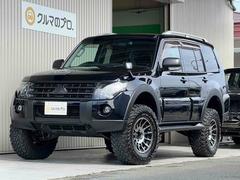 パジェロ ロング エクシード 2インチリフトアップ ENKEI 17インチアルミホイール GEOLANDAR M/Tタイヤ ブラックアウトカスタム インナーブラック ルーフレール テールランプカバー ナビ TV ドラレコ ETC 中古車画像