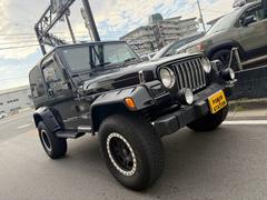 ジープ・ラングラー サハラ 当社ユーザー様買取車 社外オーバーフェンダー 社外アルミタイヤ 車検対応 中古車画像