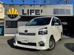 ヴォクシー ZS 煌 ETC バックカメラ ナビ TV 両側電動スライドドア HID スマートキー 後席モニター 3列シート CVT アルミホイール 記録簿 盗難防止システム 衝突安全ボディ ABS エアコン 中古車画像