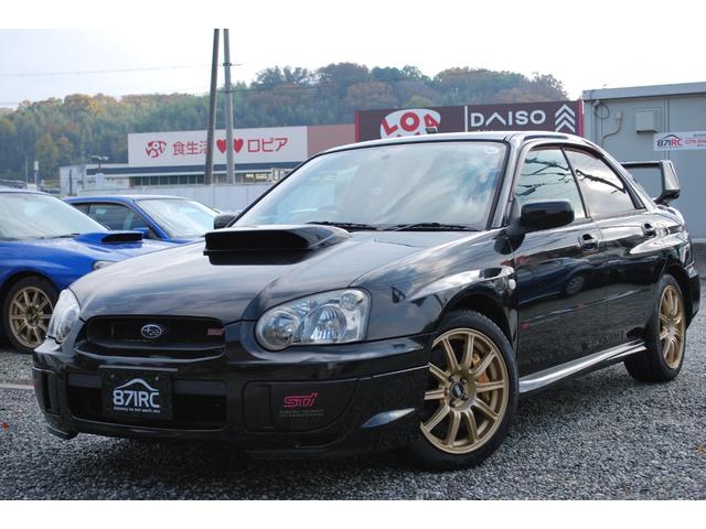 インプレッサ(スバル) ＷＲＸ　ＳＴｉ　修復歴無　タイミングベルト９２５６４ｋｍ時交換ステッカー　オプションＢＢＳ１７アルミ　外マフラー　Ｄｅｆｉ追加メーター　純正ブレンボ　ＳＴＩスポーツシート　大型Ｒスポイラー　キセノンライト　バイパー 中古車画像