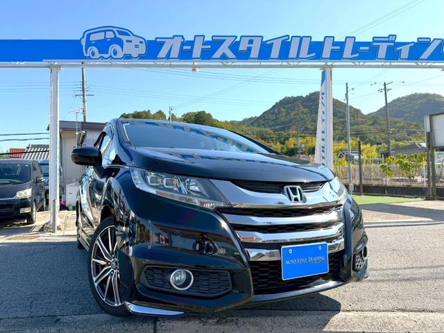 オデッセイ(ホンダ) アブソルート　あんしんパッケージ／左側パワースライド／ナビ　あんしんパッケージ／左側パワースライドドア／純正ナビ／バックカメラ／スマートキー／クルーズコントロール／Aftermarket１８アルミ／後席モニター／ＥＴＣ／地デジ／プッシュスタート／ＬＥＤライト／フォグ／３列シート 中古車画像