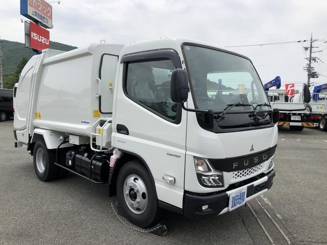 キャンター 　プレス式パッカー車　４．３ｍ３　新明和工業製　２．３ｔ積載　連続積込　汚水タンク付　標準幅　リヤシャッター式扉　１５０馬力　準中型７．５ｔ免許（1枚目）