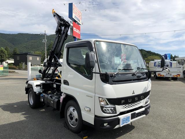 キャンター 　フックロール　極東開発工業製　脱着式コンテナ専用車　３トン積載　４ナンバー　標準幅　１０尺　全低床　シングルホイスト　コード式リモコン（1枚目）