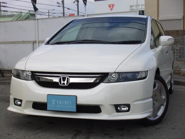 オデッセイ(ホンダ) アブソルート　修復歴無　ルームミラー式ドライブレコーダー　バックカメラ　ＨＤＤナビ　ハーフレザーシート　パワーシート　アルミホイール　ＥＴＣ　キーレス　ＣＤ　ＤＶＤ　ＴＶ　３列シート　ＨＩＤヘッドラ　フロントフォグ 中古車画像