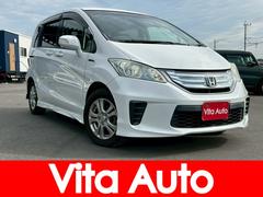 フリードハイブリッド ジャストセレクション メモリーナビ フルセグTV リアカメラ フリップダウンモニター スマートキー HIDヘッドライト 両側パワスラ Bluetooth クルコン 社外15インチアルミ ETC 中古車画像