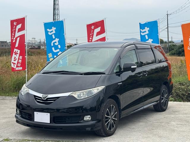 エスティマハイブリッド(トヨタ) Ｇ　パーキングアシスト／バックカメラ／４ＷＤフロントサイドカメラ／クルコンスマートキー／両側電動スライドドア／ＥＴＣ／電動シート／ドラレコ／フリップダウンモニター／ハイブリッド／テレビ／ナビ 中古車画像