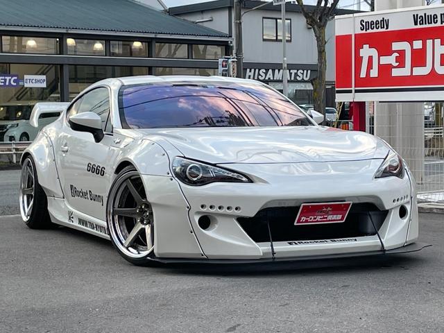 トヨタ ８６ｇ ロケットバニーワイドボディ公認 ３２６パワー車高調 リアウイング ｗｏｒｋジースト１９ａｗ ｈｋｓレーシングサクション ブリッツタワーバー パナソニックナビ 地デジ モモステアリング 社外マフラーの中古車 12 平成24 年式 走行6 0万キロ 車体色