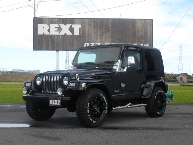 ジープ・ラングラー(ジープ) サハラ　ハードトップ　Aftermarketバンパー　フォグ　AftermarketＡＷ　レタータイヤ　ステップ　Aftermarketマフラー　ヒッチメンバー 中古車画像