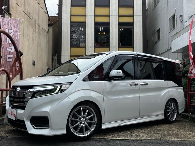 ステップワゴンスパーダ ｅ：ＨＥＶスパーダ　Ｇ・ＥＸ　ホンダセンシング　ＷＯＲＫ　ＬＡＮＶＥＣ　ＬＳ１０　１８インチアルミホイール　ＴＥＩＮ車高調　車中泊用ベッドキット　ワンオーナー　禁煙車　走行中テレビ視聴可　スペアキー（1枚目）