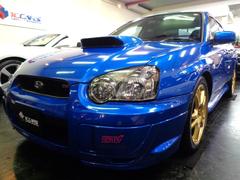 インプレッサ WRX STi WRブルーカラーSTIエアロEJ20BOXERターボエンジン4WD6MTミッションSTIゲノムマフラーHKS車高調ブレンボキャリパーDCデフコントロールSTIアルミMOMOステアリングTベルト交換済 中古車画像