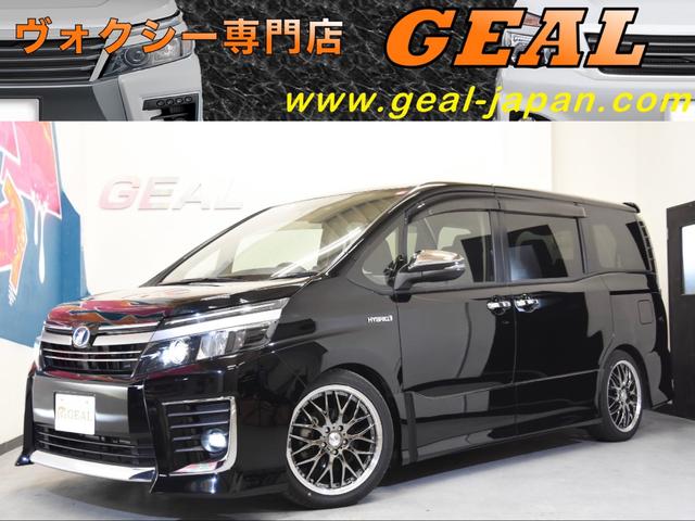 トヨタ ヴォクシーハイブリッドｚｓ 煌ｉｉ ｈｖ ｚｓ煌ｉｉｂフルエアロ１８インチａｗ 車高調 ９型ナビ １２型リアフリップダウンモニター 両側電動スライドドアの中古車 車体価格286万円 16 平成28 年式 走行2 1万キロ 車体色ブラック 大阪府高槻市柱本３ ５ ８