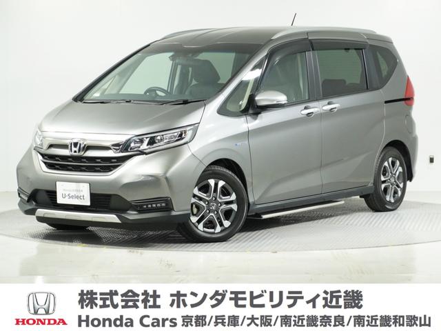 フリード+ハイブリッド ハイブリッド・クロスターホンダセンシング 1オ-ナ-ナビDレコRカメETC両電扉BT地デジ アダプティブクルーズコントロール Bluetooth シートヒーター 左側オートサイドステップ DVD 15インチ純正アルミホイール 禁煙車(1枚目)