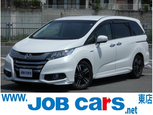 オデッセイハイブリッド(ホンダ) ハイブリッドアブソルート・ＥＸホンダセンシング　ホンダセンシング　両側電動スライドドア　後席モニター　Ｂスポットモニター　ハーフレザーシート　純正ナビ　フルセグ　全周囲カメラ　ＥＴＣ　ＬＥＤヘッドランプ　純正１７インチＡＷ　パワーシート　オットマン 中古車画像