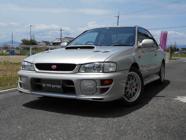 WRXタイプR STiバージョンV クーペ 5MT BBS16インチアルミ タイベル交換済み クラッチ交換済み MOMOハンドル STiショック・マフラー・タワーバー ケンウッドオーディオ ユーザー買取車(1枚目)