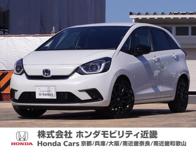 フィット ｅ：ＨＥＶホーム２０周年特別仕様車カーサ　ワンオーナー　７インチナビ　バックカメラ　ＥＴＣ　アダプティブクルーズコントロール　シートヒーター　Ｂｌｕｅｔｏｏｔｈ　ＵＳＢ入力端子　ＬＥＤヘッドライト　衝突被害軽減ブレーキ　純正アルミホイール（1枚目）