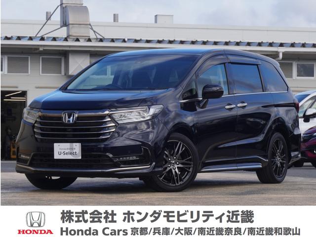 オデッセイハイブリッド(ホンダ) ｅ：ＨＥＶアブソルート・ＥＸ　ワンオーナー　１０インチナビ　全周囲カメラ　ドラレコ　ＥＴＣ２．０　アダプティブクルーズコントロール　両側電動スライドドア　シートヒーター　オットマン　ジェスチャーコントロールパワースライドドア 中古車画像