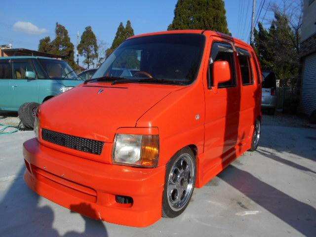 スズキ ワゴンｒ カスタムの中古車 車体価格28万円 1998 平成10 年式 走行12 0万キロ 車体色オレンジ 大阪府大東市龍間１９２０ ７０ ｋｉｎｇｓ 阪奈山頂店の在庫 グーネット中古車