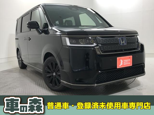 ステップワゴン(ホンダ) ｅＨＥＶスパーダプレミアムラインブラックエディション　登録済未使用車　マルチビューカメラ　運転席助手席シートヒーター　二列目オットマン　パワーテールゲート　ブラックエディション専用装備　純正アルミホイール　ホンダコネクト 中古車画像