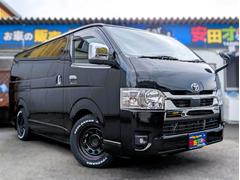 ハイエースバン スーパーGL ダークプライムII フリップダウン 大型ナビ デイトナホイール 新品ジオランダーホワイトレター 全方位モニター 両側パワースライド デジタルミラー リヤフィルム施工 衝突軽減ブレーキ ハーフレザーシート 純正ホイール 中古車画像