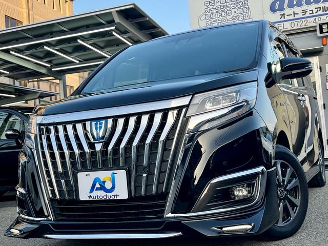 エスクァイア(トヨタ) ハイブリッドＧｉ　純正１０インチナビ　フルセグテレビ　バックカメラ　天井モニター　衝突軽減　両側電動　革調シート　クルコン　スマートキー　シートヒーター　エアロ　ＬＥＤヘッドライト　フォグ　ドラレコ　ＥＴＣ　純正アルミ 中古車画像