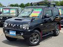 ジムニー ランドベンチャー　１０型ＡＴ　４ＷＤ　メモリーナビ　記録簿　レザーシート　シートヒーター　ドラレコ　フルセグＴＶ　ＥＴＣ　ＤＶＤ再生　ツイーター　けん引フック　ルーフキャリア　サイドガード　マッドガード　ターボ　革巻ハンドル　背面カバー　フォグ　電格ミラー（1枚目）