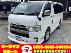 ハイエースバン スーパーGL ダークプライムII 6型 ベッドキット アルパインフリップダウンモニター モデリスタフロントスポイラー LEDフォグランプ リアスライドガラス小窓 ユーアイビークルフロアマット ミラー型バックモニター 100V電源 中古車画像