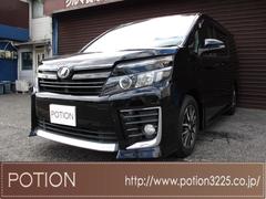 ヴォクシー ZS ワンオーナー 純正9インチSDナビ フルセグTV ブルートゥース DVD再生 ETC バックカメラ フリップダウンモニター リモコンエンジンスターター 両側パワースライドドア 16インチアルミホイール 中古車画像