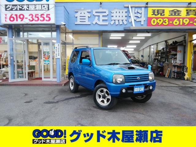 ジムニー(スズキ) ＸＣ　走行８９５２０ｋｍ　背面タイヤ　ルーフレール　電動格納ミラー　フォグランプ　ＥＴＣ　ＣＤ再生　キーレス　１６インチアルミホイール　エアコン　パワーステアリング　ＡＢＳ　ダブルエアバック 中古車画像