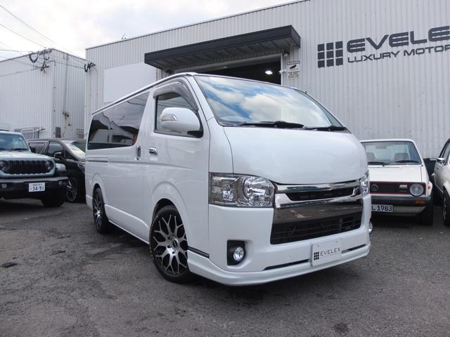 ハイエースバン(トヨタ) スーパーＧＬ　ダークプライム　車検Ｒ９年１月　両側電動スライドドア　公認キャプテンシート　フリップダウンモニター　ベッドキット　ＥＳＳＥＸ製ホイール　ＨＤＤフルセグナビ　ボンネット　AftermarketＬＥＤテール　玄武ブロック　セキュリティ 中古車画像