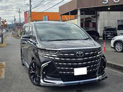 アルファードハイブリッド エグゼクティブラウンジ モデリスタエアロF.S.Rシグネチャーイルミサイドエンブレムイルミユニバーサルステップデジタルインナーミラー左右独立ムーンルーフJBLサウンドシステムリアエンターテイメントパノラミックビューモニター 中古車画像