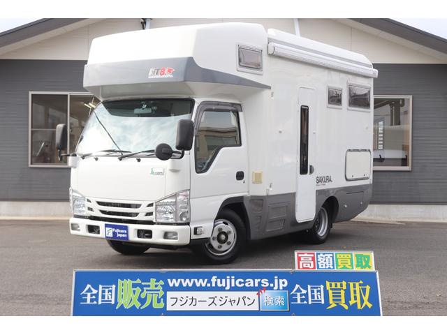 いすゞ ＮＴＢ　サクラ　７名乗車　軽油　ＦＦヒーター　２４Ｖエアコン　ソーラー４枚ＴＶ　ＦＦヒーター　サイドオーニング　電子レンジ　マックスファン　１５００Ｗインバーター　外部電源　メモリーナビ　ミラーモニター　ＥＴＣ