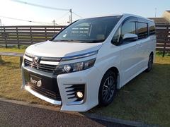 ヴォクシー ZS グー鑑定証付き ETC ナビ TV クリアランスソナー 両側電動スライドドア LEDヘッドランプ スマートキー アイドリングストップ 電動格納ミラー 後席モニター 3列シート CVT アルミホイール 中古車画像