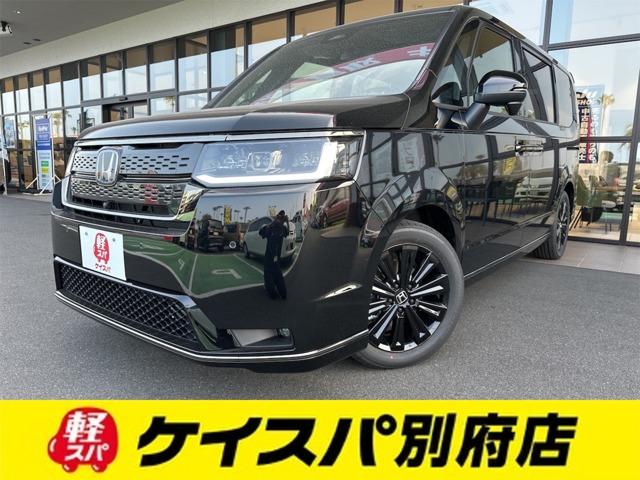 ステップワゴン ｅＨＥＶスパーダプレミアムラインブラックエディション　バックカメラ　フロントカメラ　クリアランスソナー　オートクルーズコントロール　レーンアシスト　衝突被害軽減システム　両側電動スライドドア　オートライト　ＬＥＤヘッドランプ　スマートキー　電動格納ミラー（1枚目）