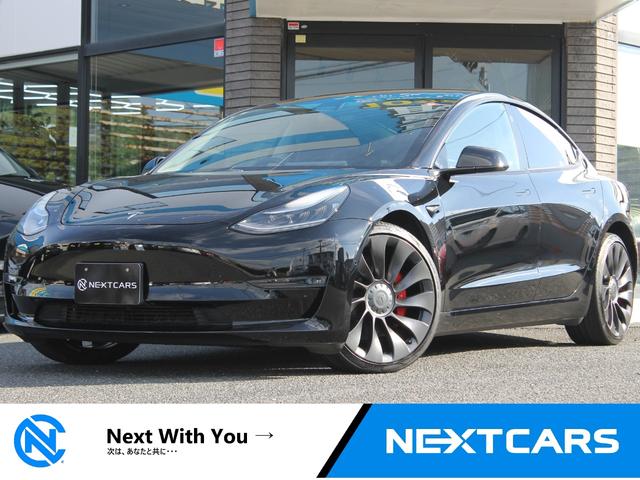 モデル３(テスラ) 　デュアルモーター・ブラックプレミアムインテリア・オートパイロット・２０インチ純正アルミ・カーボンスポイラー・パフォーマンスＡＷＤ・パフォーマンスブレーキ・パノラマルーフ・Ｂｌｕｅｔｏｏｔｈ・ＥＴＣ 中古車画像