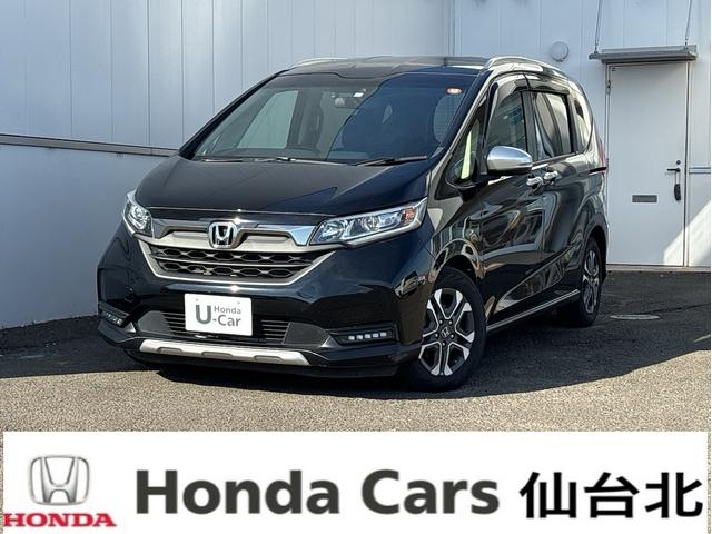 フリード＋ハイブリッド(ホンダ) ハイブリッド・クロスター　ホンダセンシング　レーダークルーズ　レーンキープ　純正９インチナビＴＶＢカメラ　Ｂｌｕｔｏｏｔｈ　前後ドラレコ　ルーフレール　シートヒーター　ＬＥＤオートライト　ＥＴＣ　ＵＳＢ　両側ＰＷスライド 中古車画像