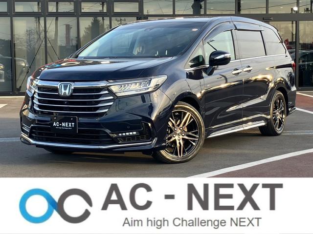 オデッセイハイブリッド(ホンダ) ｅ：ＨＥＶアブソルート・ＥＸ　純正１０インチナビ　全周囲カメラ　フルセグＴＶ　Ｂｌｕｅｔｏｏｔｈ　純正後部座席モニター　ＡＣＣ　ドラレコ　両側電動スライドドア　パワーバックドア　Ｐシート　シートヒーター　Ｐアシスト　オットマン 中古車画像