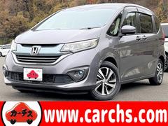 フリードハイブリッド ハイブリッド・EX 6名 ホンダセンシング!純正ナビ&フルセグTV&BT&バックカメラ!LEDヘッドライト!オートライト!純正アルミ!ハーフレザーシート!シートヒーター!両側パワースライドドア!純正ETC!ハーフレザー 中古車画像