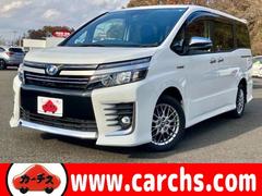 ヴォクシー ハイブリッドZS 煌II セーフティセンスC!純正ナビ&フルセグTV&BT&バックカメラ!フリップダウンモニター!両側パワースライドドア!LEDヘッドライト!オートライト!純正アルミ!ビルトインETC2.0 中古車画像