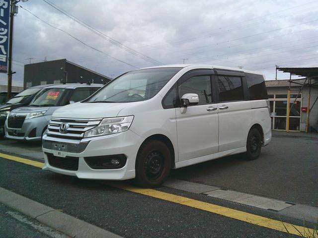 ステップワゴンスパーダ(ホンダ) Ｚ　４ＷＤ　オートマ　リア両側電動スライドドア　ＨＩＤ　純正ナビ　バックカメラ　アイドリングストップ車　Aftermarketシートカバー　Aftermarketマフラー 中古車画像