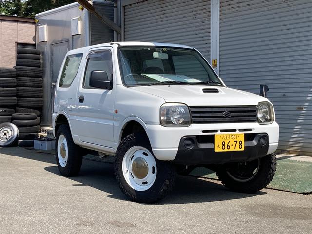 ジムニー(スズキ) ＸＧ　４ＷＤ　５速マニュアル　社外アルミホイール　ＭＴタイヤ　キーレスエントリー　ＥＴＣ 中古車画像