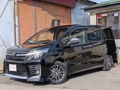 ヴォクシー ZS 煌II バックカメラ TV レーンアシスト 衝突被害軽減システム 両側電動スライドドア オートマチックハイビーム オートライト LEDヘッドランプ スマートキー アイドリングストップ 後席モニター 3列シート 中古車画像